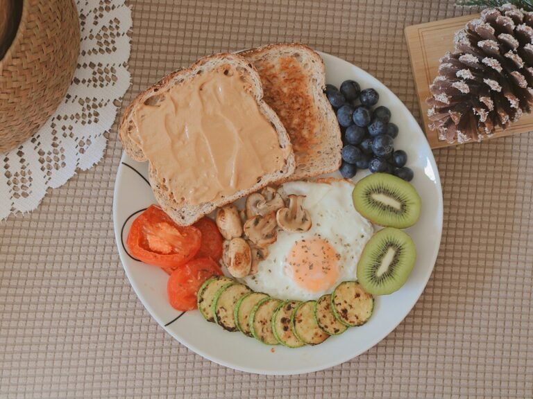 bread with sliced fruits on white ceramic plate