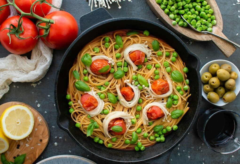red tomato on black round plate